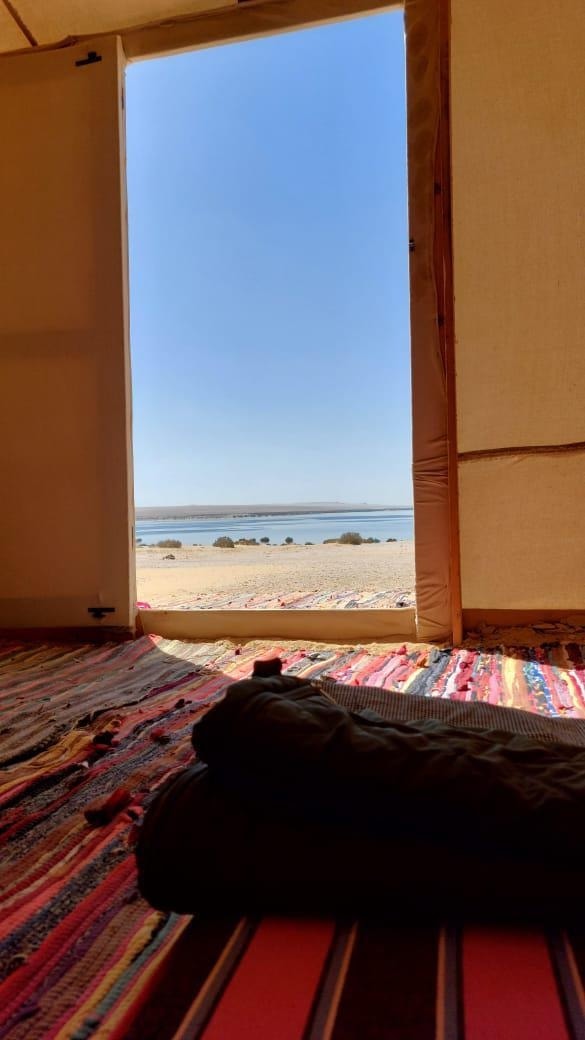 The view of the lake from inside a tent