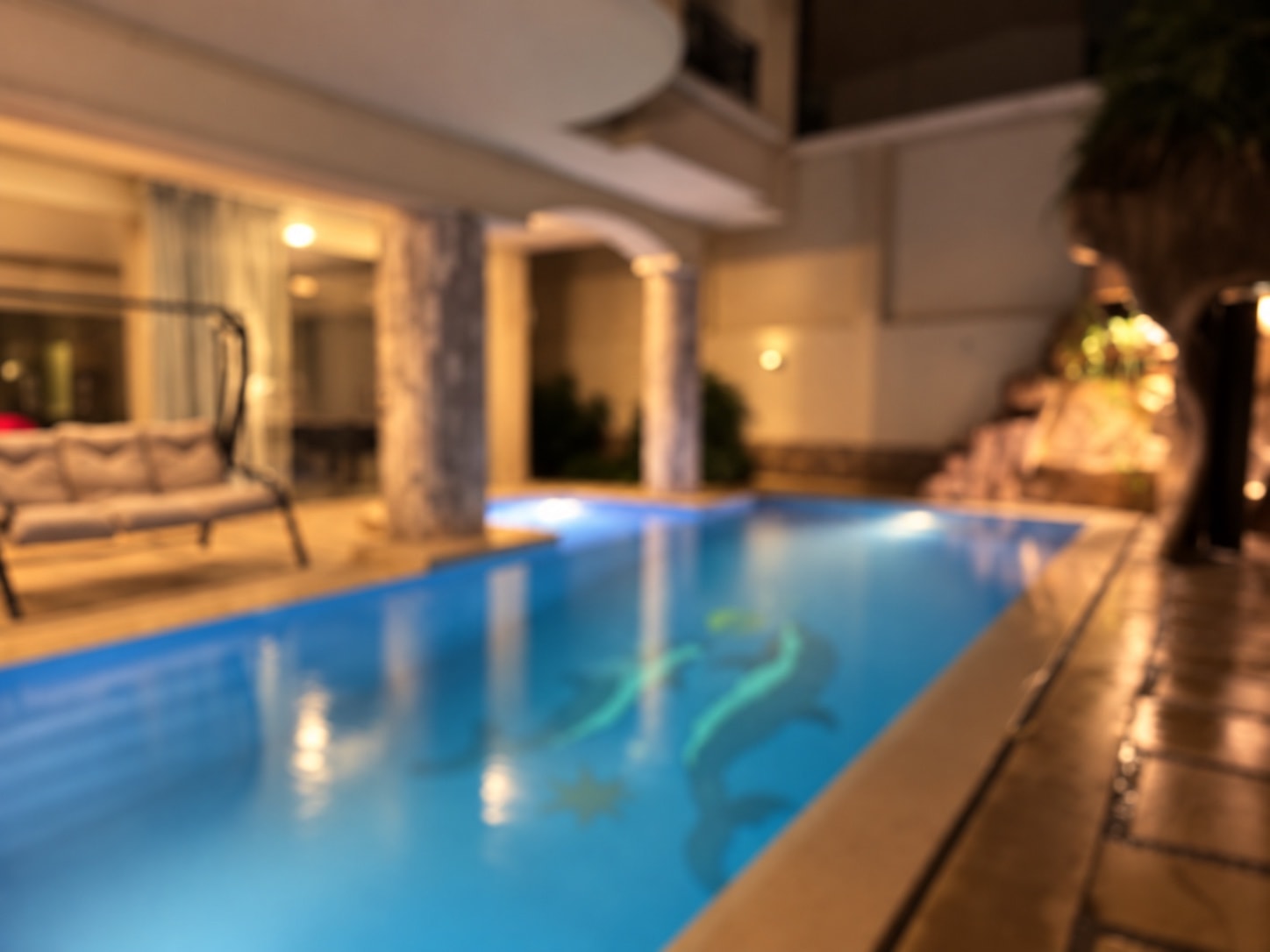 The lit heated pool at Glasshouse Pools in New Cairo
