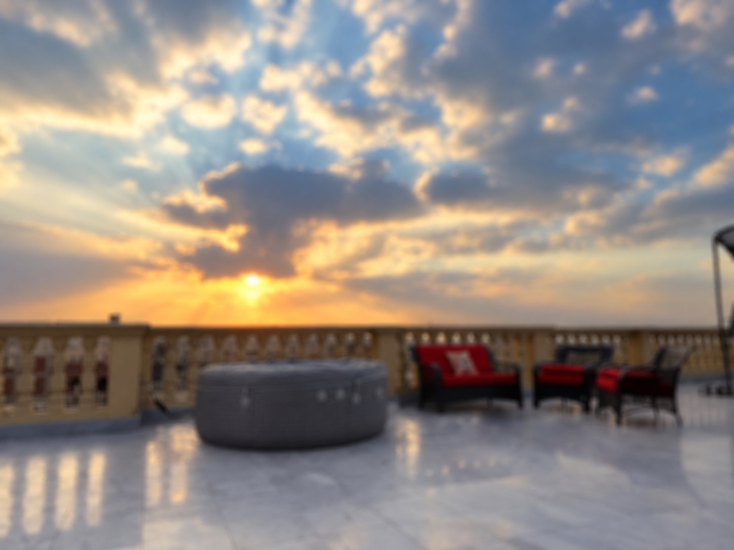 The rooftop jacuzzi and terrace of the New Cairo penthouse at sunset